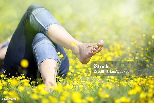 Woman Lying In Meadow Relaxing Stock Photo - Download Image Now - Barefoot, Grass, Meadow