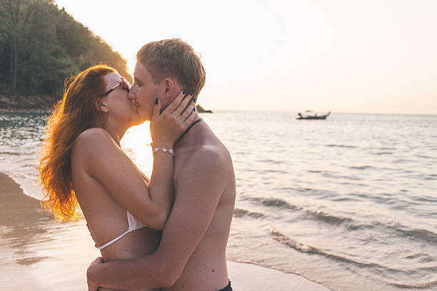 istock Young Couple on the Beach 496602089