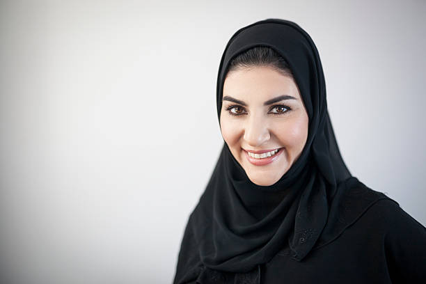 istock Smiling Arab Woman with Light Grey Vignetted Background 496603060
