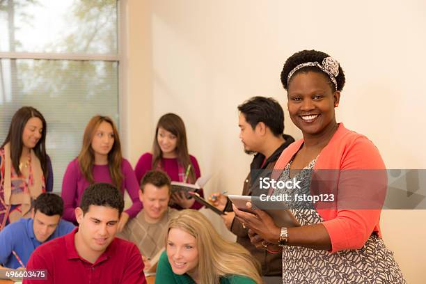 Education Diverse College Students Teacher In Classroom Stock Photo - Download Image Now