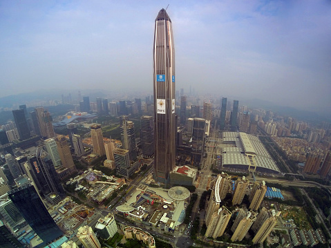 Shenzhen, Сhina - November 5, 2015: Ping An International Finance Centre building (also known as the Ping An IFC) 115-story skyscraper under construction expected to be completed in 2016, and will at that time be the 4th tallest building in the world in Coco park shopping mall downtown Shenzhen, Guangdong province, November 5, 2015. 