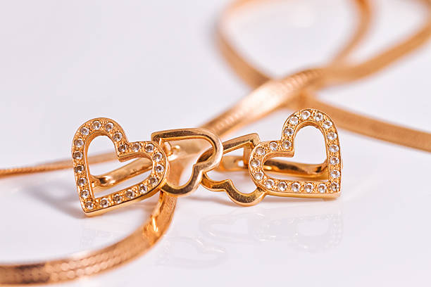 istock Gold earrings heart shaped 496605544