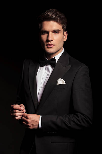 istock elegant young man fixing his sleeve 496606888