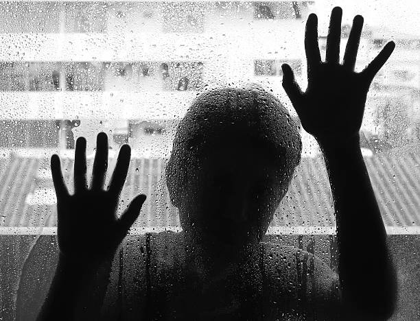 istock Horror woman behind the matte glass ,style  black and white 496607864