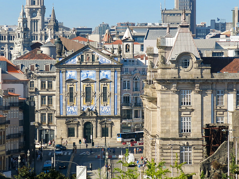 Street view of Bolhao Market in the morning, Porto, Portugal. People can be seen outside of the beautiful building.