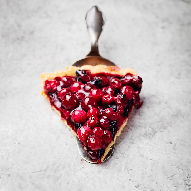 Tart, pie, cake with jellied fresh cranberries, bilberries