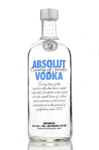 Kwidzyn, Poland - April 19, 2015: Absolut vodka isolated on white background. Absolut vodka has been produced in southern Sweden since 1879. Absolut was bought by French group Pernod Ricard in 2008
