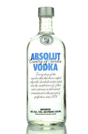 Kwidzyn, Poland - April 11, 2015: Absolut vodka isolated on white background. Absolut vodka has been produced in southern Sweden since 1879. Absolut was bought by French group Pernod Ricard in 2008