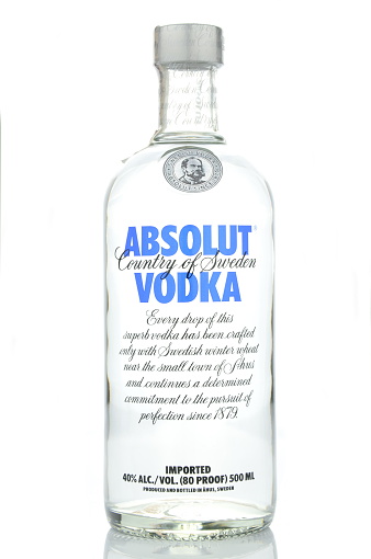 Kwidzyn, Poland - April 15, 2015: Absolut vodka isolated on white background. Absolut vodka has been produced in southern Sweden since 1879. Absolut was bought by French group Pernod Ricard in 2008