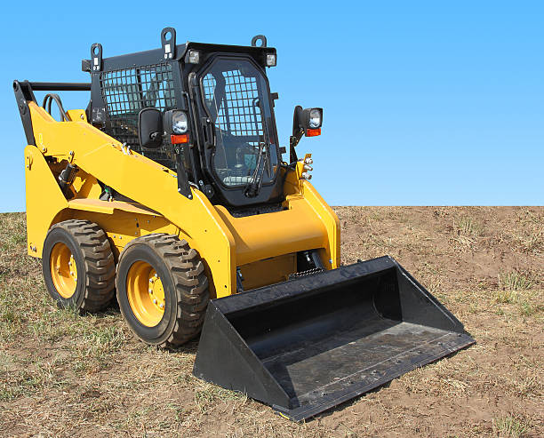 istock The yellow truck with a scraper to lift cargo. 496612898