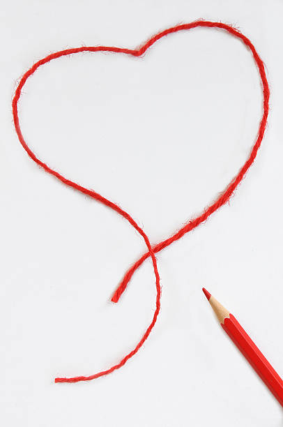 istock red pencil and heart 496615917