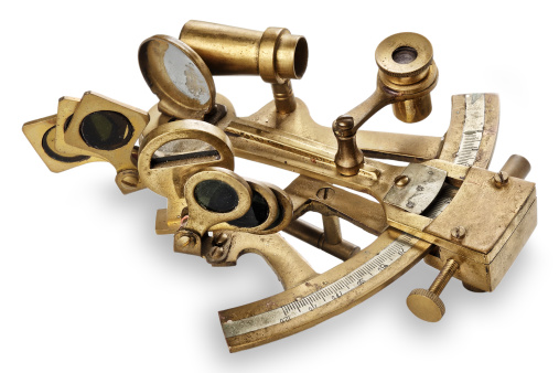 old bronze sextant on the white background