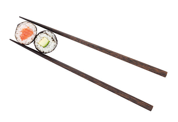 istock Sushi maki with salmon and cucumber in chopsticks 496616601