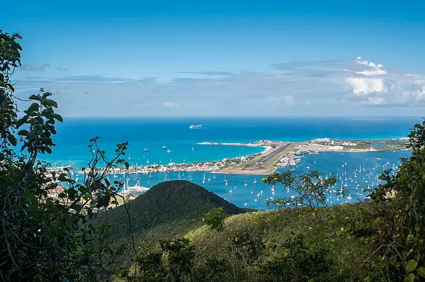 View from the hilly center of the island on the famous Maho-Beach with Princess Juliana Airport, St. Maarten, Caribbean