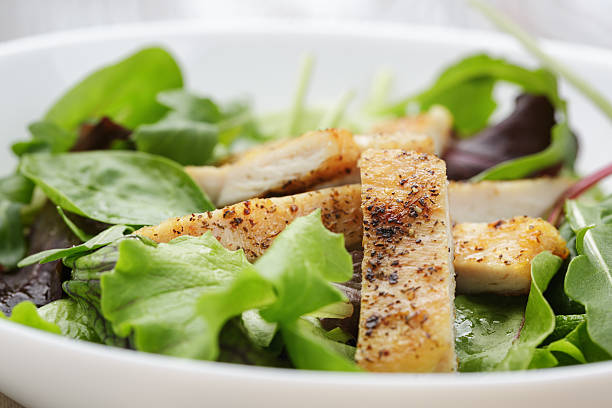 istock roasted chicken with mix salad 496617073