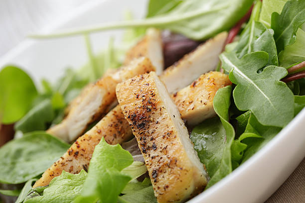 istock roasted chicken with mix salad 496617075