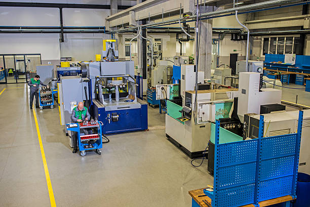istock Workers At The Manufacturing Plant 496617353