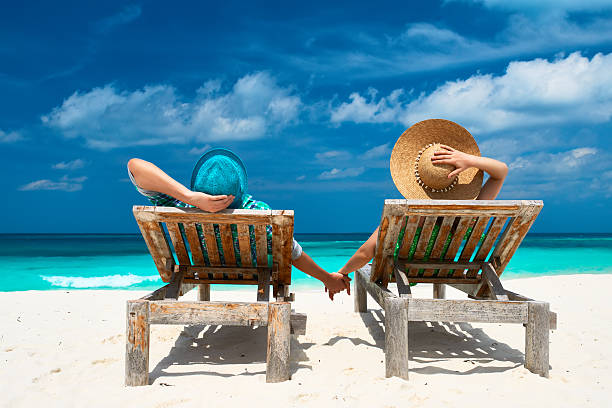 istock Couple in green on a beach at Maldives 496617435