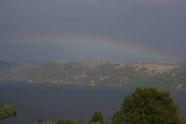 Amazing rainbow arching right over Lochness, Scotland