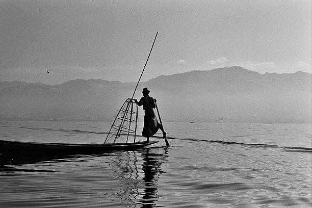 istock Burmese fisherman waiting for bait 496618575
