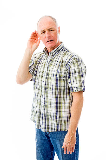 Senior man trying to listen isolated on white background Senior man trying to listen isolated on white background old man cupping his ear to hear something stock pictures, royalty-free photos & images