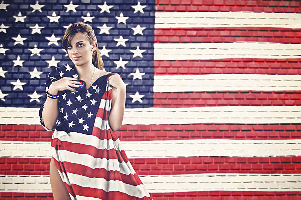 istock american woman with national flag 496619197