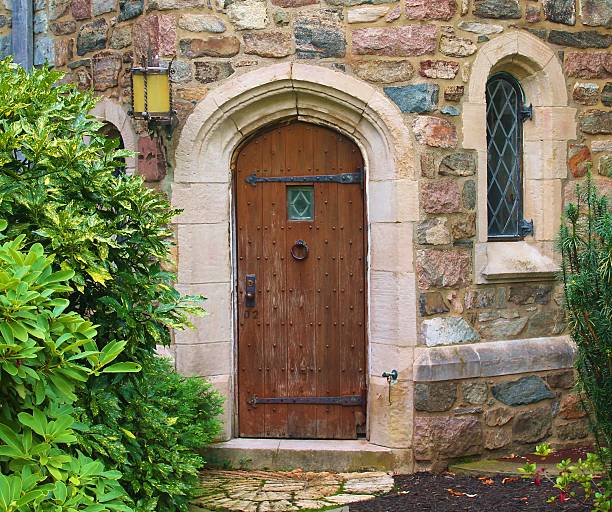 istock Antique Decorative Wooden Door on a Brick Building 496622023