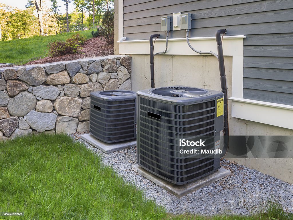 Hvac units Residential heating and air conditioner compressor units near suburban house Air Conditioner Stock Photo Hvac units Residential heating and air conditioner compressor units near suburban house Air Conditioner Stock Photo