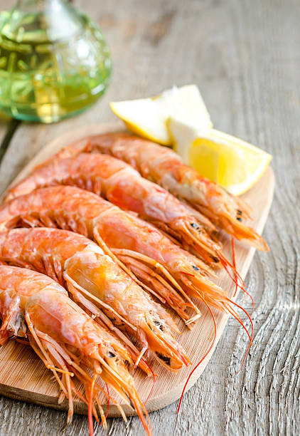 istock Shrimps on the wooden board 496622531