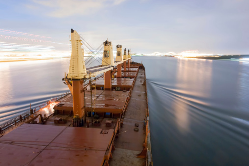 Ship is sailing to Great Lakes at USA & Canada - blurred motion - Night Sailing at Canal - Long exposure.