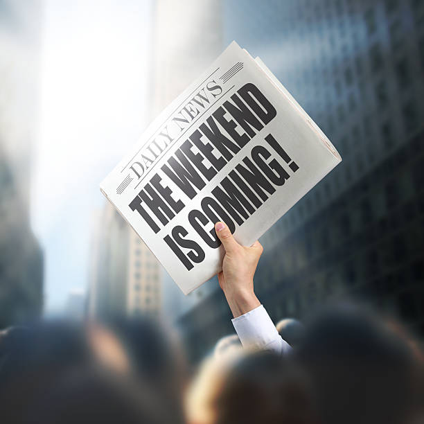 istock Holding Newspaper Weekend is Coming 496623411