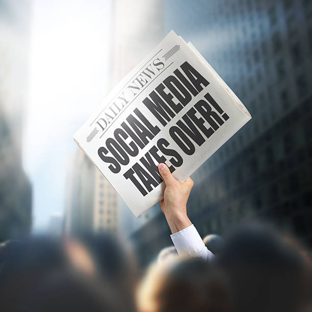 istock Holding Newspaper Social Media takes 496623415