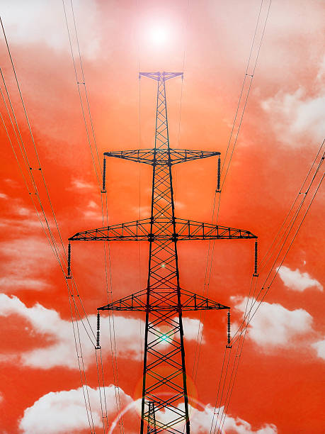 istock Electricity pylon with shine on red background. 496623819