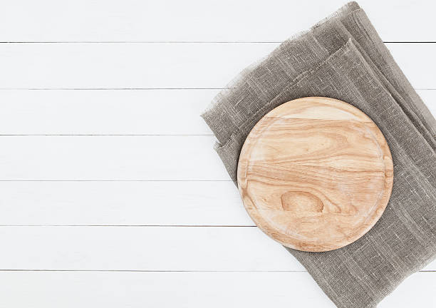 istock cutting board on wooden table. top view 496626296