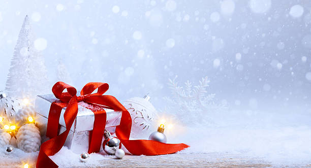 istock art Christmas balls and gift box on snow 496630482