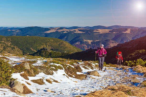 istock Hikers Climbs Up on Trail Towards High Mountain Ridge 496630484