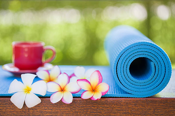 istock yoga mat and a cup of coffee 496630682