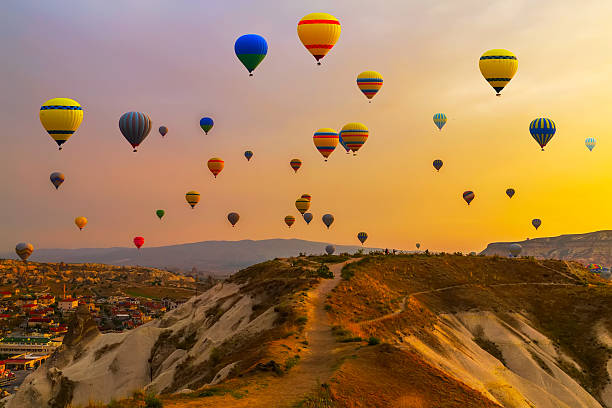 balloons CappadociaTurkey. Hot air balloons landing in a mountain Cappadocia Goreme National Park Turkey. nevsehir stock pictures, royalty-free photos & images