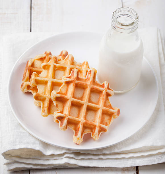 istock Fresh waffles with a bottle of milk Breakfast table. 496633134