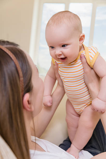 istock three month baby with mom 496633442