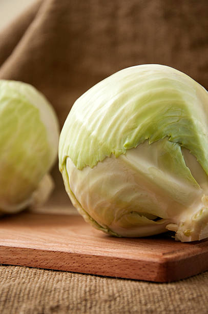 istock cabbage on a wooden board on a background sacking, burlap 496634176
