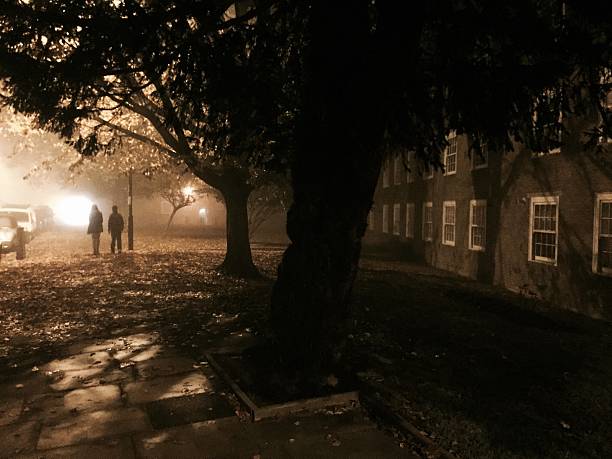 Gloomy street, people walking stock photo