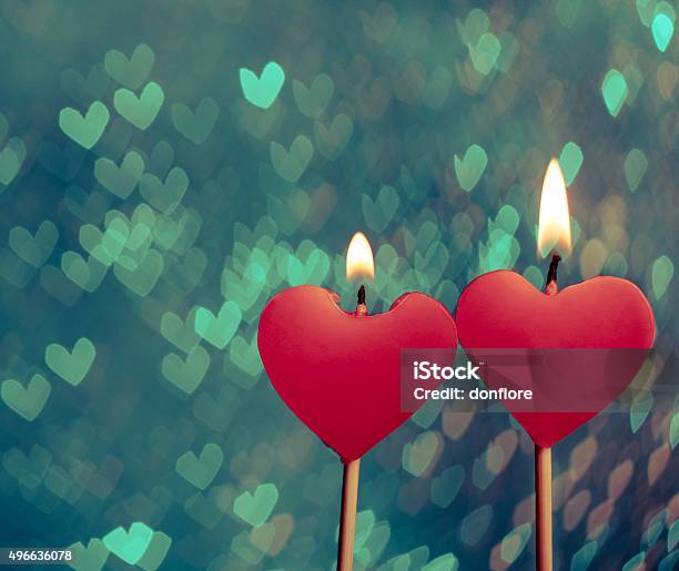 Red Hearts Candles On Vintage Hearts Bokeh As Background Stock Photo - Download Image Now