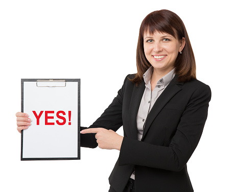 A pretty businesswoman carrying an empty clipboard