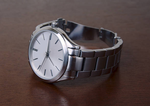 istock Silver Metal Wrist Watch on Tabletop 496638522