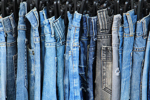 istock Row of hanged jeans 496645159