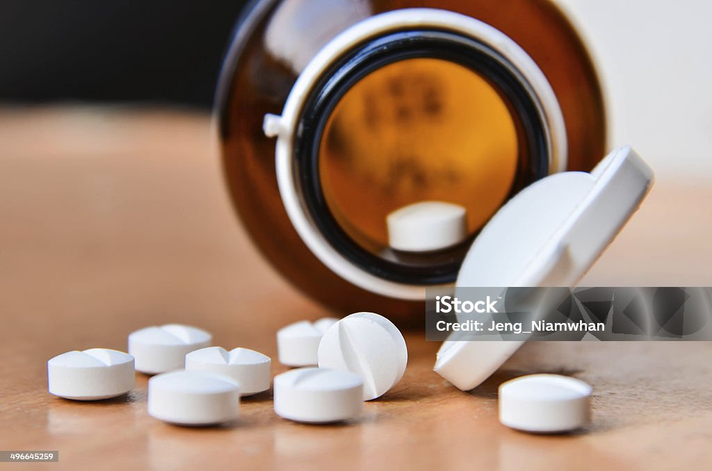 Pills and bottle. Addiction Stock Photo