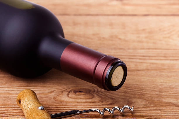 istock corkscrew and bottle of wine on the board 496645297