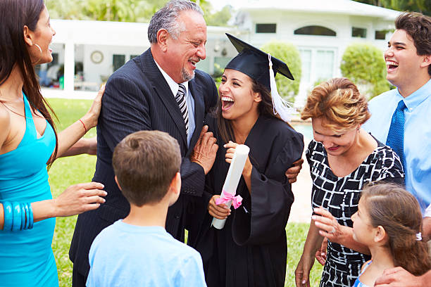 istock Hispanic Student And Family Celebrating Graduation 496647177