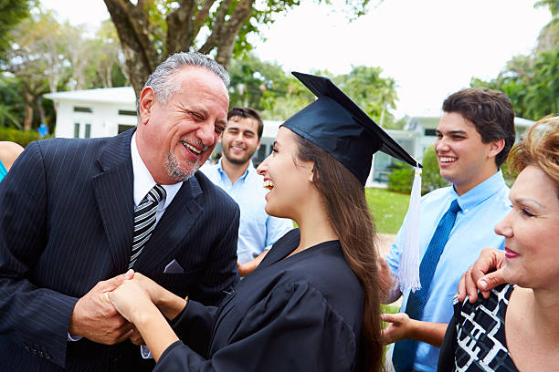 istock Hispanic Student And Family Celebrating Graduation 496647327